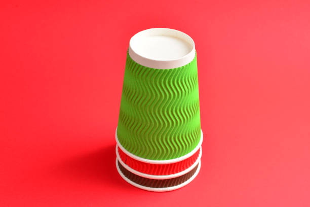 istock Red, green, brown paper cups on a red background. Copy space. 1135302834