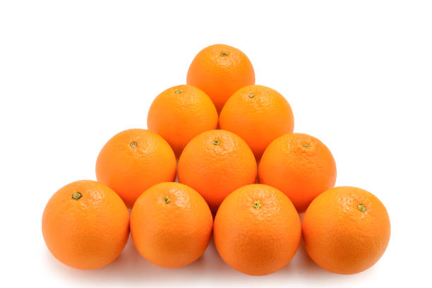 istock Pyramid of Oranges isolated on white background. 1135302956