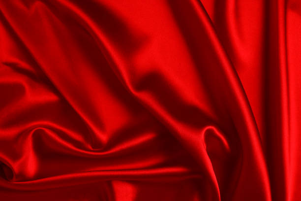 istock Red silk or satin luxury fabric texture can use as abstract background. Top view. 1135302959