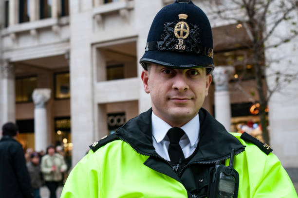 Police Officer of the Metropolitan Police Service London, United Kingdom - 26. December 2007.,Portrait captured on the street of London and with the will of Constable to pose, some noise may occur metropolitan police stock pictures, royalty-free photos & images