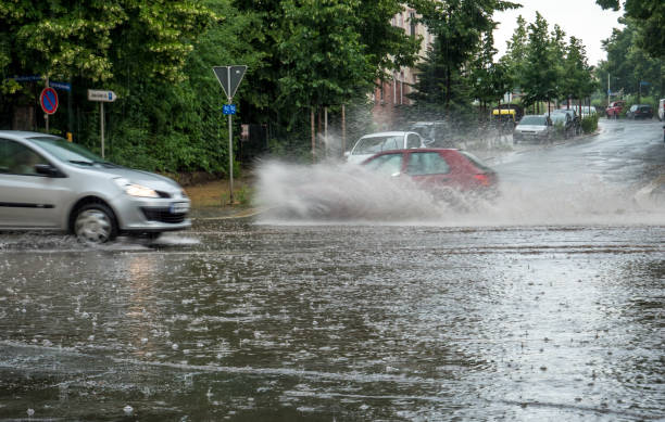 Net on the scaffold for safety flooded city road with rain puddles heavy rainfall stock pictures, royalty-free photos & images