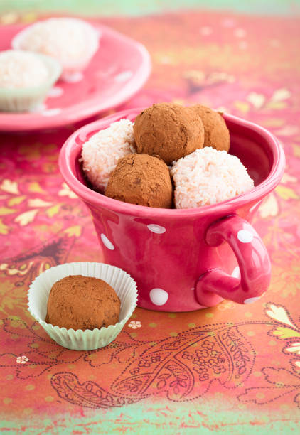 food Cup of Chocolate Truffles chocolate truffle making stock pictures, royalty-free photos & images