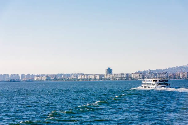 istock Ferry sailing to city on sea 1135308277