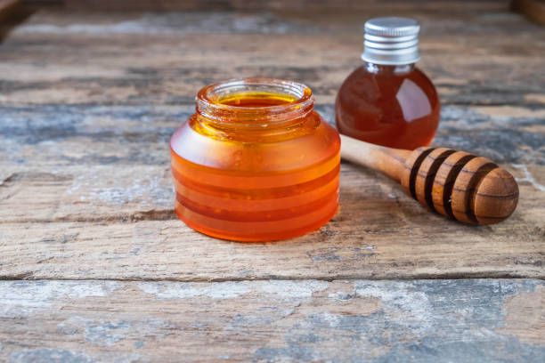 istock Organic honey on wooden table 1135308370