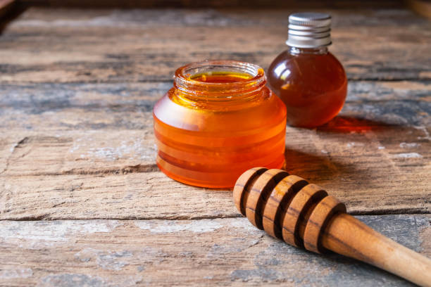 istock Organic honey on wooden table 1135308401