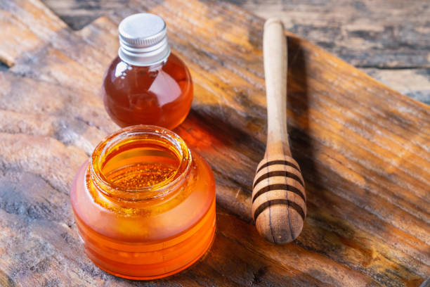 istock Organic honey on wooden table 1135308415