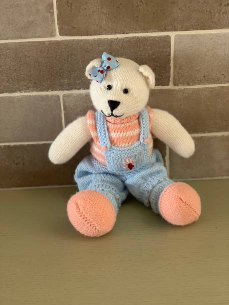 istock Hand made knitted cute bear toy girl 1135311067