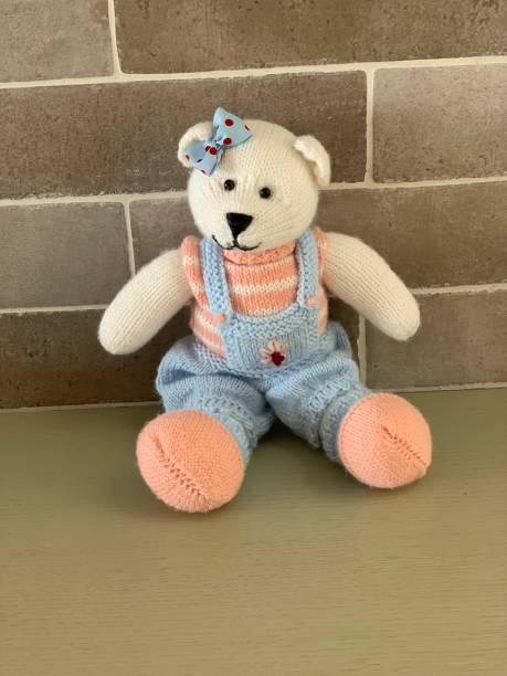 istock Hand made knitted cute bear toy girl 1135311082