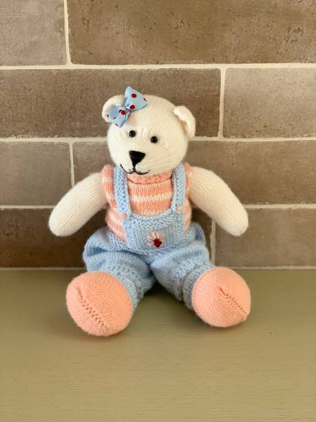 istock Hand made knitted cute bear toy girl 1135311086