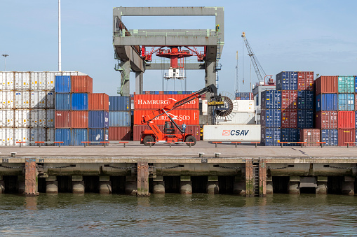 NETHERLANDS, ROTTERDAM, - APRIL 19, 2018, The maritime cargo business counts around 6,000 cargo vessels in movement at any one time, carrying 20,000,000 shipping containers. In 2018, The port of Rotterdam alone transits 469 Million tonnes of goods, of which 30% are containers.
