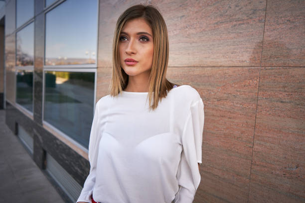 istock Young woman  posing outdoors in colorful clothes 1135313508