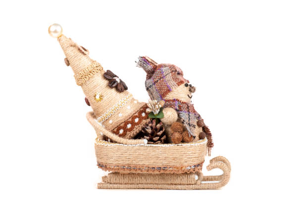 istock snowman with a Christmas tree sitting in a sleigh, isolated 1135314342