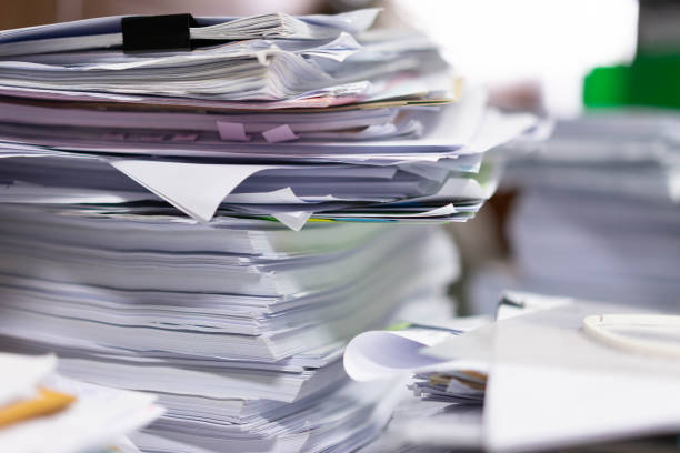 istock A lot of documents in the office, boring work days 1135315123