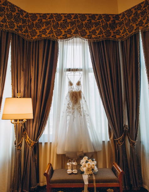 istock wedding dress bride room interior window curtains 1135315180