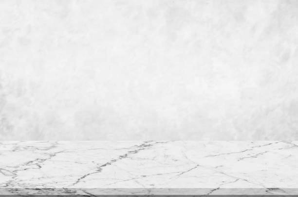 istock Counter top,perspective white marble with blurred white or light grey marble stone natural texture background design of decoration clean background.Used for montage or display product backdrop. 1135316146
