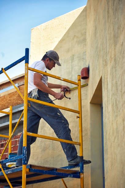 istock Builder at the finish house working with the tool. 1135316347