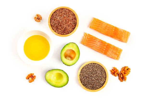 ingredients of a healthy omega-3 diet. raw salmon, avocado, nuts, chia and flax seeds, shot from the top on a white background - nutritional supplement salmon food flax imagens e fotografias de stock