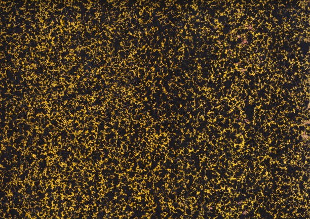 Dark vintage marbled effect yellow and black endpaper background stock photo