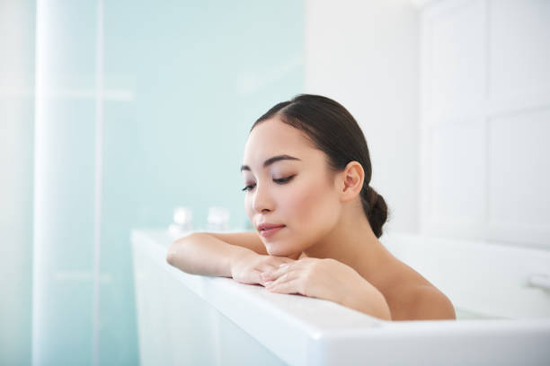 istock Relaxed and calm asian lady being in bath 1135316637