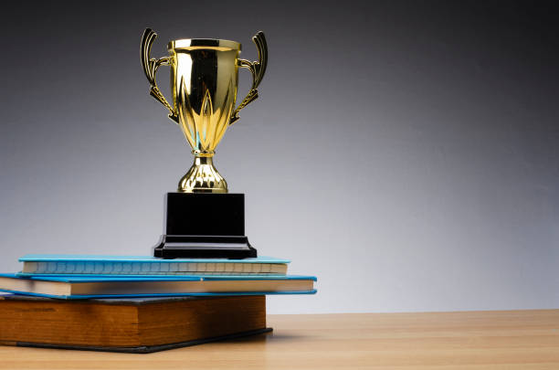 istock trophy on stack of book for education success concept. 1135317733