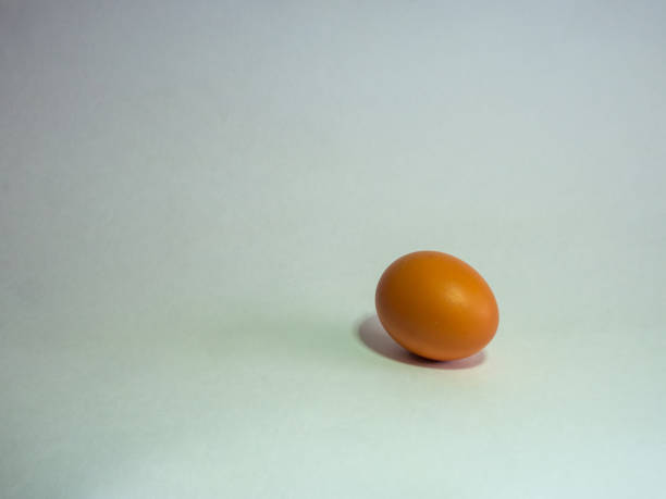 istock Eggs of brown color prepare for Easter on a light background 1135319429