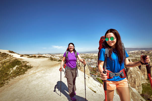 istock Adventure trekking in the mountains with a backpack and tent. 1135319923