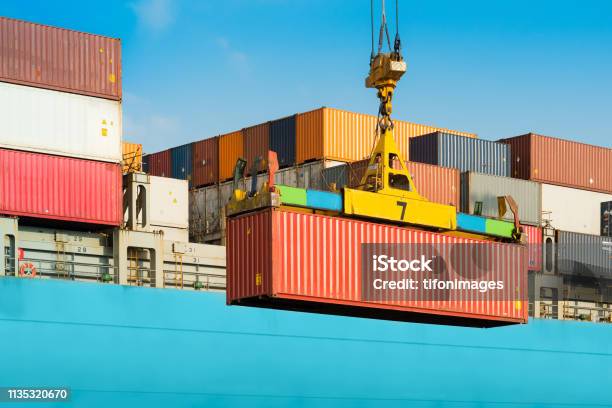 Cargo Ship Being Loaded With Containers Stock Photo - Download Image Now - Container, Cargo Container, Harbor