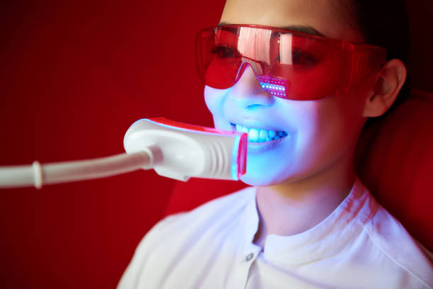 Young asian lady have tooth whitening procedure