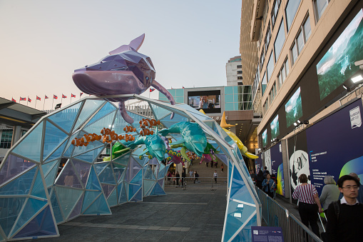 Hong Kong, Hong Kong - March 12, 2019 : People walk past the shopping district in Tsim Sha Tsui. Harbour City is the largest shopping mall in Tsim Sha Tsui, Kowloon, Hong Kong.