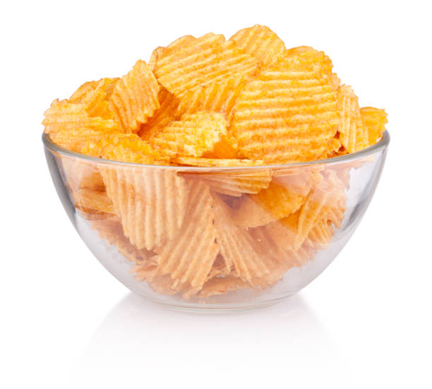 istock Crinkle cut potato chips in bowl isolated on white background 1135322537