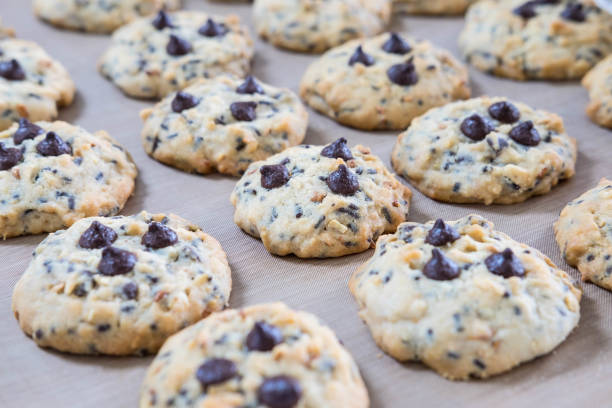 istock Chocolate chip cookies on tray after take off oven when finished baked 1135322555