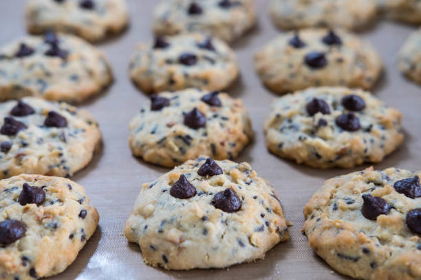 istock Chocolate chip cookies on tray after take off oven when finished baked 1135322683