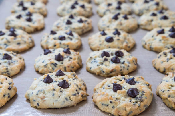 istock Chocolate chip cookies on tray after take off oven when finished baked 1135322767