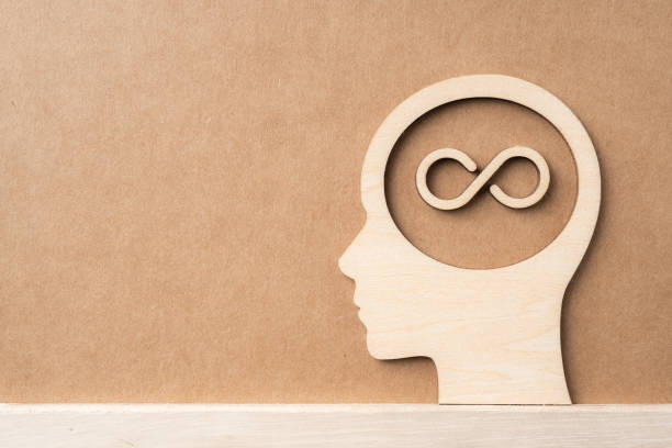 istock wooden man head silhouette with infinity icon 1135323414