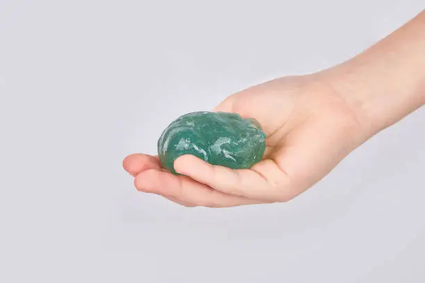 Photo of hand holding a slime