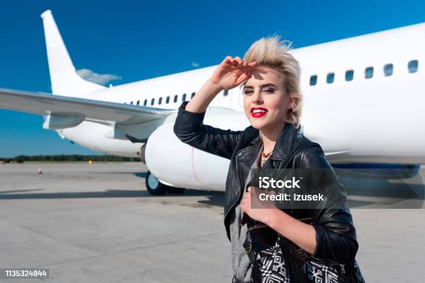 Attractive Young Woman At Airport Stock Photo - Download Image Now - Adult, Adults Only, Airplane