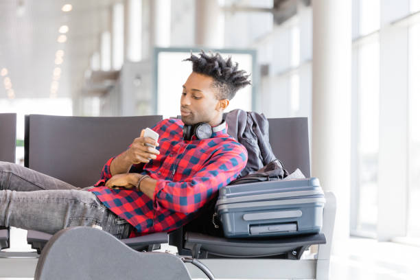 istock Young african man waiting for boarding 1135325630