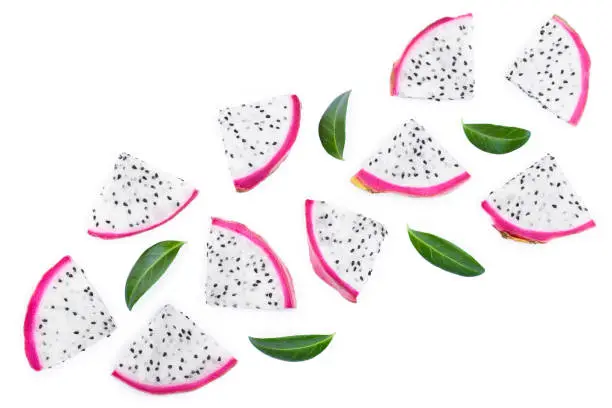 piece of Dragon fruit, Pitaya or Pitahaya with leaves isolated on white background with copy space for your text. Top view. Flat lay.