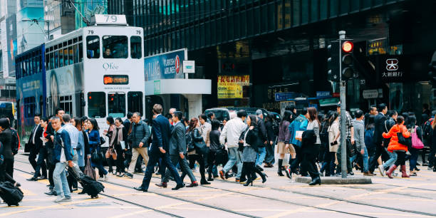 istock Hong Kong crowd commuter crossing crosswalk rush hour 1135327267