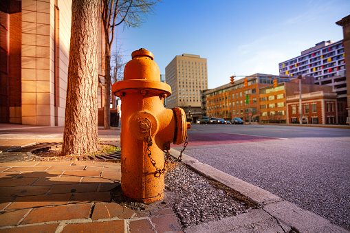 red fire valve at the street focus on foreground