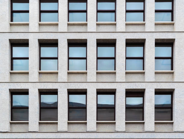 istock External facade of a modern building with glass windows and reflections 1135329992