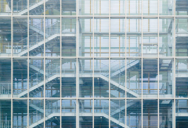 details of the facade of a modern skyscraper made of glass and steel closeup. Shanghai World Financial Center.
