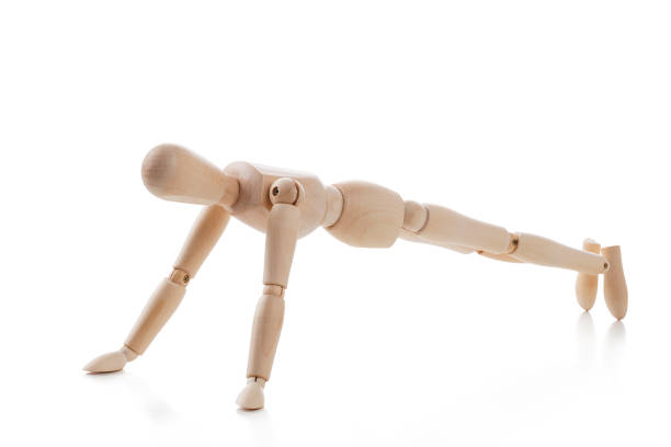 istock Wooden mannequin in Plank pose isolated on white background 1135334067
