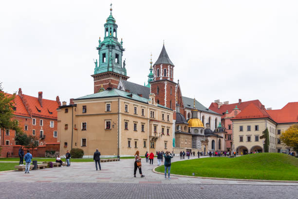 Krakow, Poland - October 8, 2018: The Wawel Castle is a castle residency located in central Krakow, Poland. Built at the behest of King Casimir III the Great,[2] it consists of a number of structures situated around the Italian-styled main courtyard. The castle, being one of the largest in Poland, represents nearly all European architectural styles of medieval, renaissance and baroque periods.