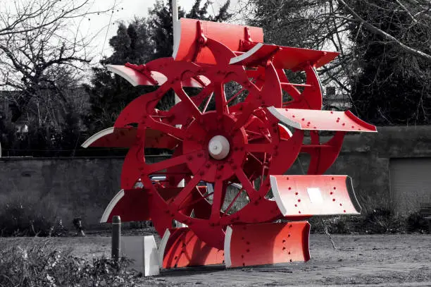 Water wheel of a paddle steamer in black white red