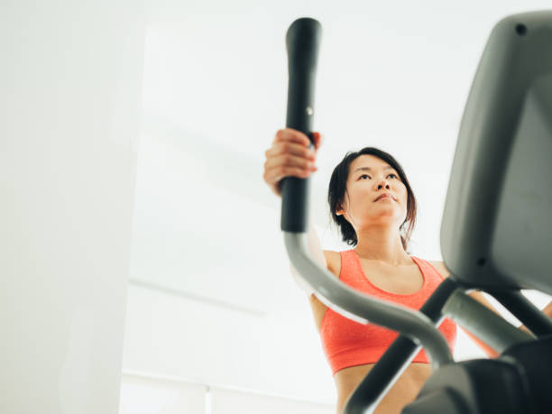 istock Young Asian woman working out 1135334688