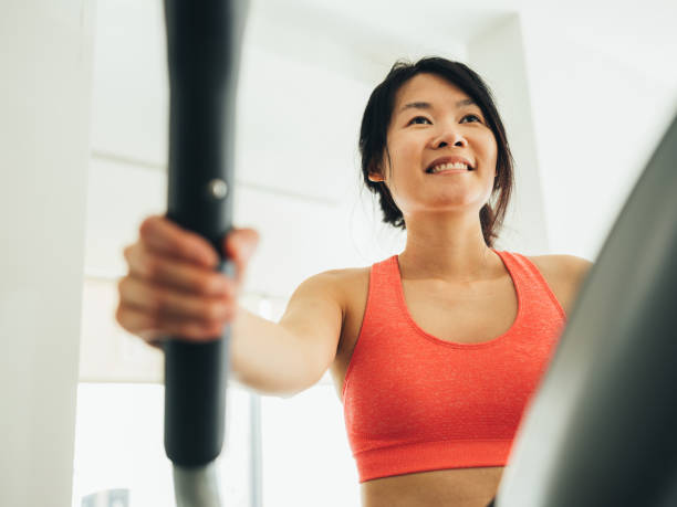 istock Young Asian woman working out 1135334692