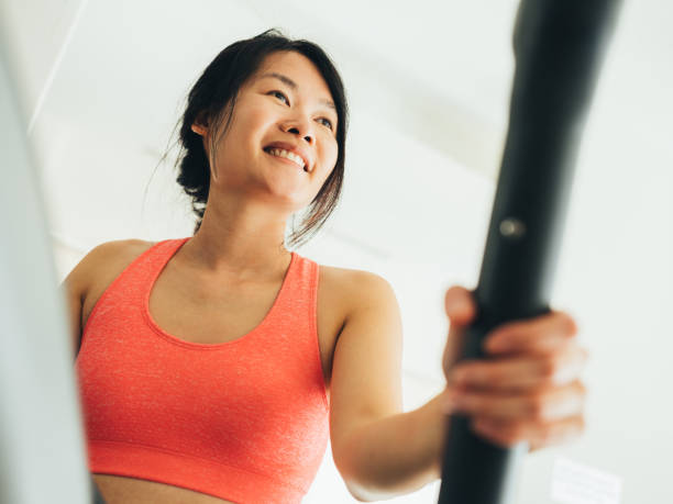 istock Young Asian woman working out 1135334813