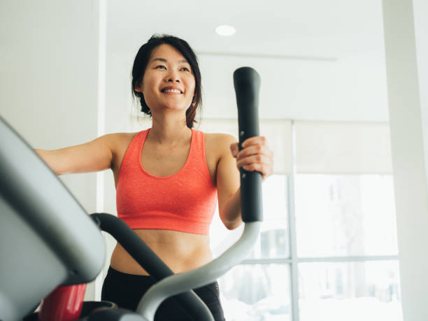 istock Young Asian woman working out 1135334902