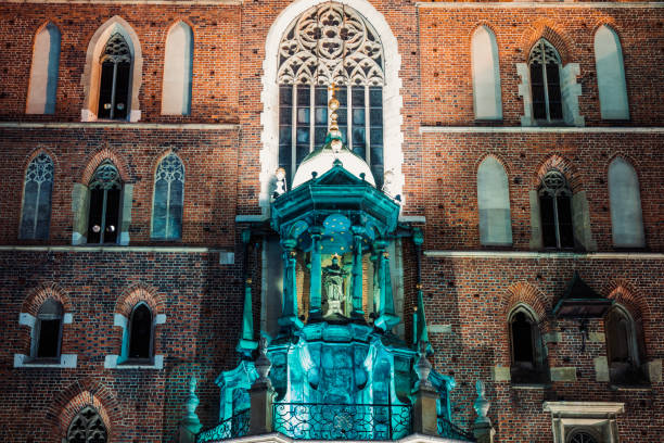 Church of Our Lady Assumed into Heaven (also known as Saint Mary's Church) is a Brick Gothic church adjacent to the Main Market Square in Kraków, Poland. Built in the 14th century, its foundations date back to the early 13th century and serve as one of the best examples of Polish Gothic architecture.